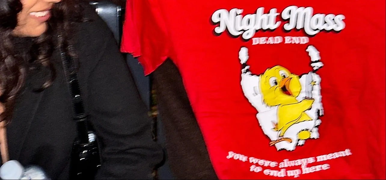 A red Night Mass t-shirt printed with a cartoon chick and the words Dead End, you were always meant to end up here